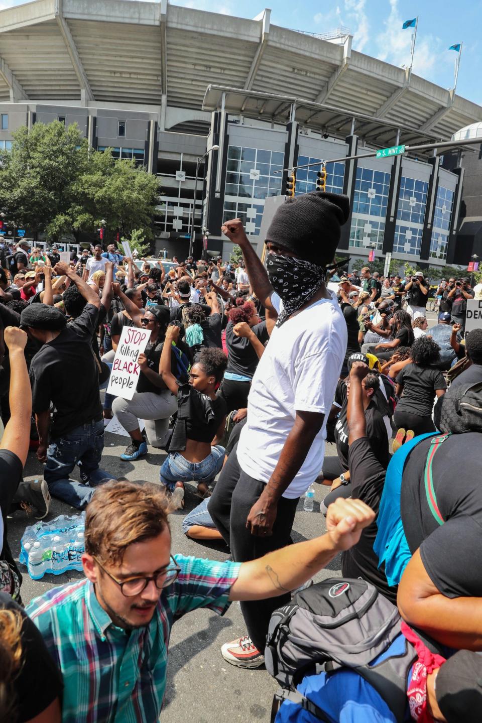 <p>Protesters outside of Bank of America Stadium take a knee during the national anthem during the game between the Carolina Panthers and the Minnesota Vikings. Mandatory Credit: Jim Dedmon-USA TODAY Sports </p>