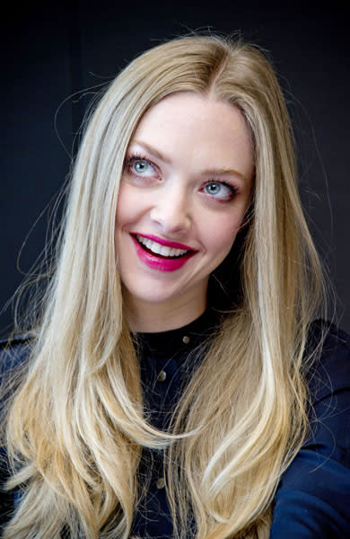 <b>Amanda Seyfried at the Les Miserables film photocall in New York, Dec 2012 <br></b><br>The actress sported a bright fuchsia lip and long wavy locks for the photocall.<br><br>© Rex