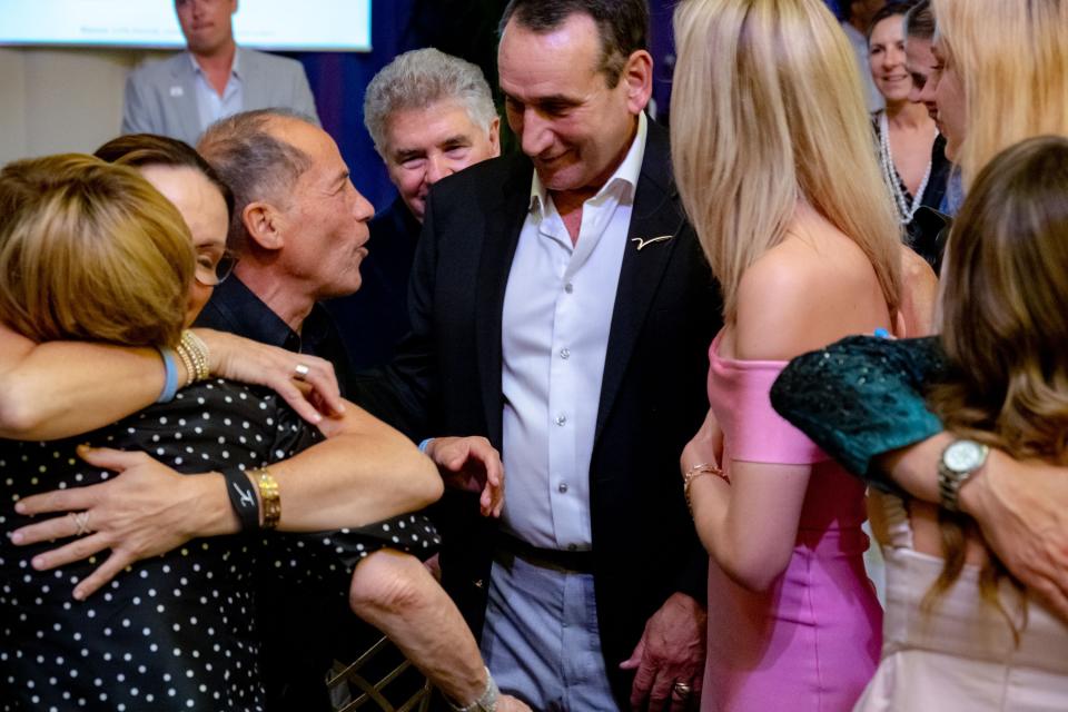 Michael Marks (left) pledged $1 million for four courtside tickets at Duke head coach Mike Krzyzewski's final game at Cameron Indoor Stadium. (Photo courtesy of the V Foundation) 