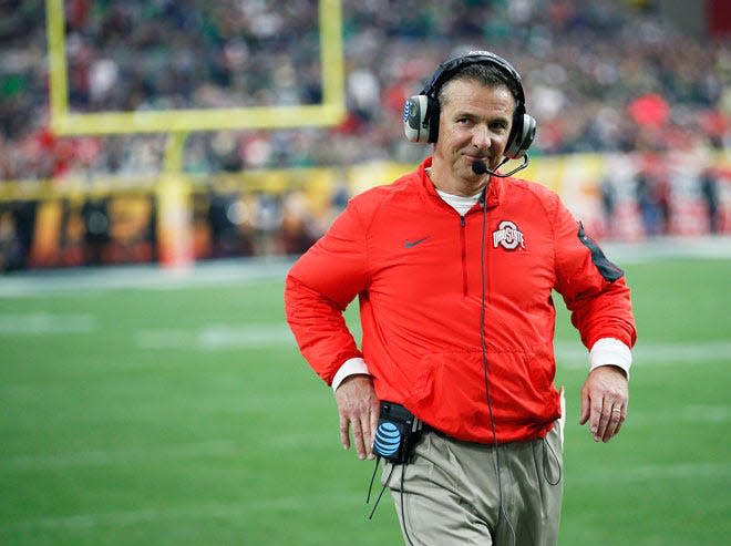 Ohio State Buckeyes head coach Urban Meyer smiles at his family following Ohio State's 44-28 win over the Notre Dame Fighting Irish in the Battlefrog Fiesta Bowl at University of Phoenix Stadium in Glendale, Arizona on Jan. 1, 2016.