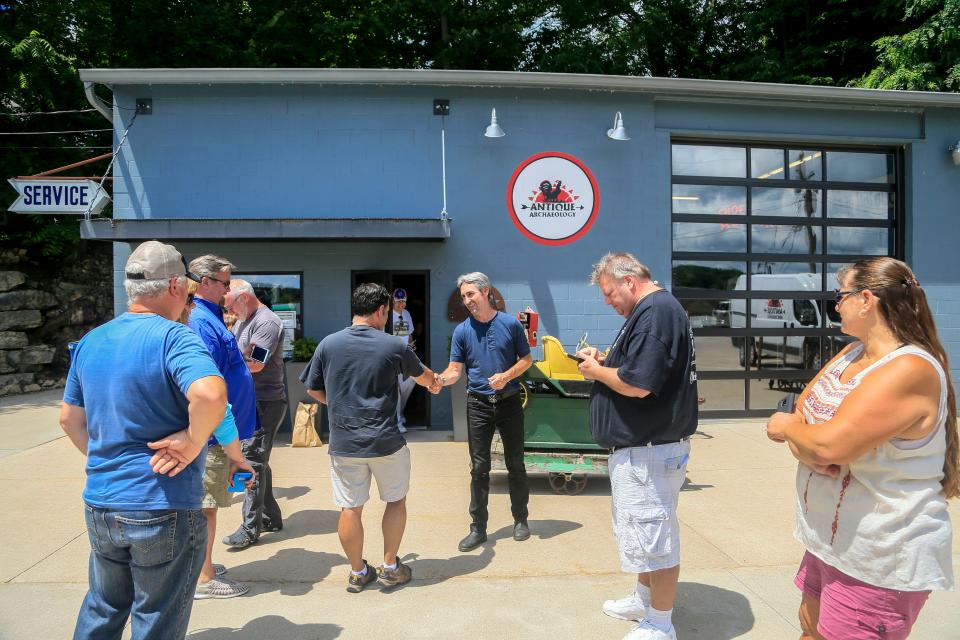 Mike Wolfe of American Pickers fame greets fans outside his store Antique Archaeology in LeClaire June 27, 2018.