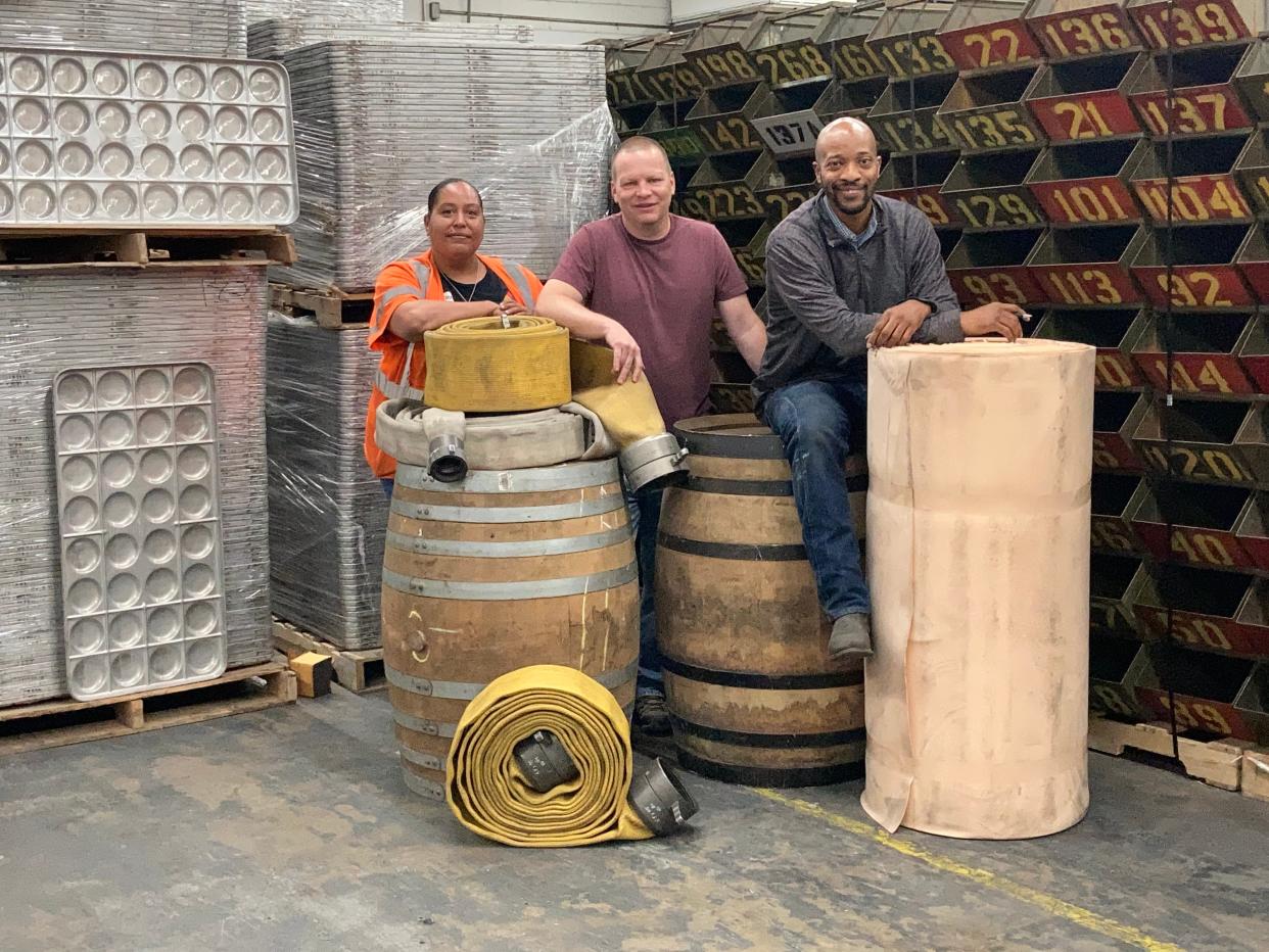 Damon Carson, founder of repurposedMATERIALS in the middle, warehouse manager Corban Bell on the right and office manager Aidhla Clark on the left.