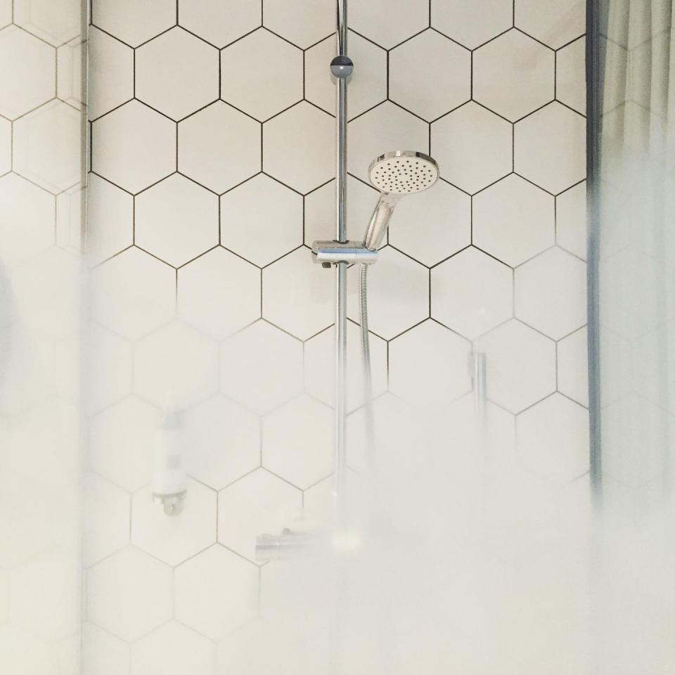 <p>The easiest way to rid your shower tiles of grout is regular upkeep, which is why our <a href="http://www.goodhousekeeping.com/home/cleaning/tips/a21016/remove-grout-stain-jul04/" rel="nofollow noopener" target="_blank" data-ylk="slk:cleaning expert Heloise;elm:context_link;itc:0;sec:content-canvas" class="link ">cleaning expert Heloise</a> says you should run a squeegee over tile after every use. By drying the walls, you'll prevent mildew stains.</p>