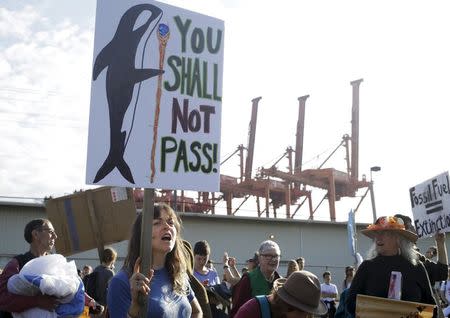 Activists march and rally at the entrance of Terminal 5 at the Port of Seattle, Washington May 18, 2015. REUTERS/Jason Redmond