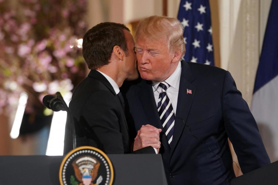 President Emmanuel Macron of France kisses President Donald Trump during a joint news conference at the White House in Washington: New York Times / Redux / eyevine