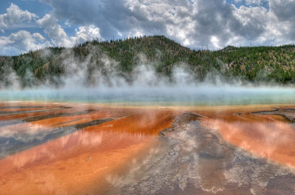 Yellowstone National Park in Wyoming and Montana features picturesque geysers, hot springs and wildlife.