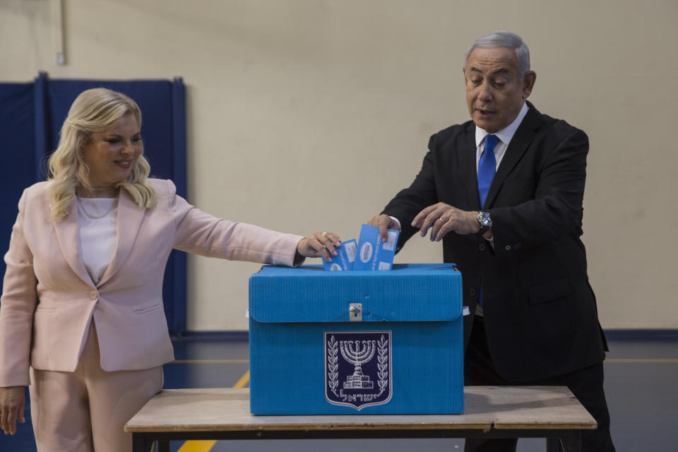 Israeli Prime Minister Benjamin and his wife Sarah casts their votes at a voting station in Jerusalem on September 17, 2019. Israelis began voting Tuesday in an unprecedented repeat election that will decide whether longtime Prime Minister Benjamin Netanyahu stays in power despite a looming indictment on corruption charges. (Heidi Levine, Sipa, Pool via AP).