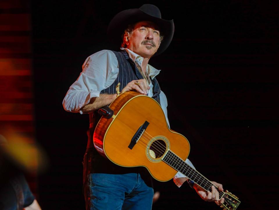 Kix Brooks holds a guitar at Stagecoach.