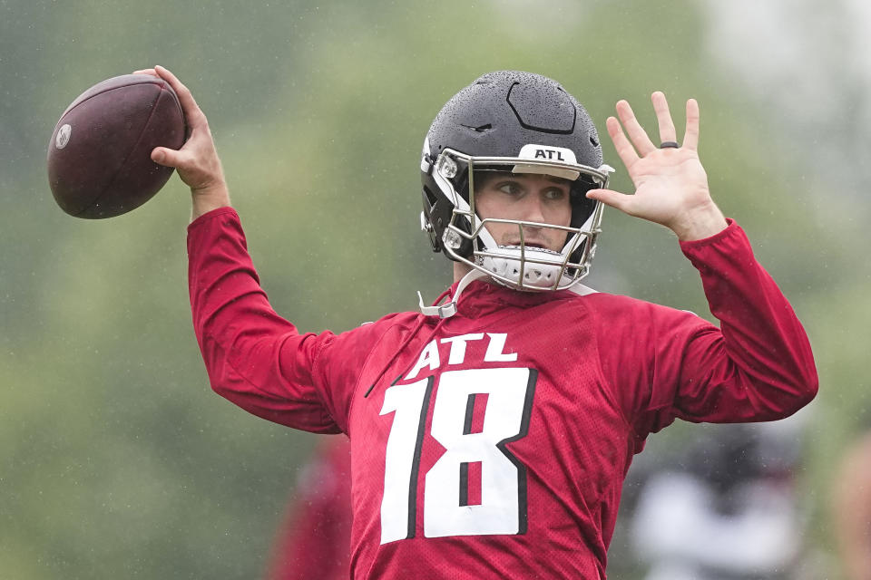 Atlanta Falcons quarterback Kirk Cousins runs drills during an NFL football mini training camp practice on Tuesday, May 14, 2024, in Flowery Branch, Ga. (AP Photo/Brynn Anderson)