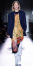 <p>The 42-year-old looked fresh-faced at Dries Van Noten, rocking the runway in a printed sheath and white boots.</p>