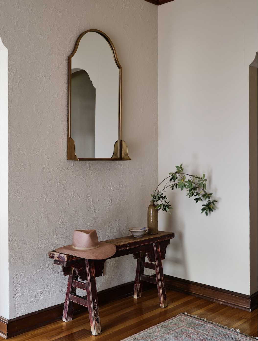 mirror above entryway bench