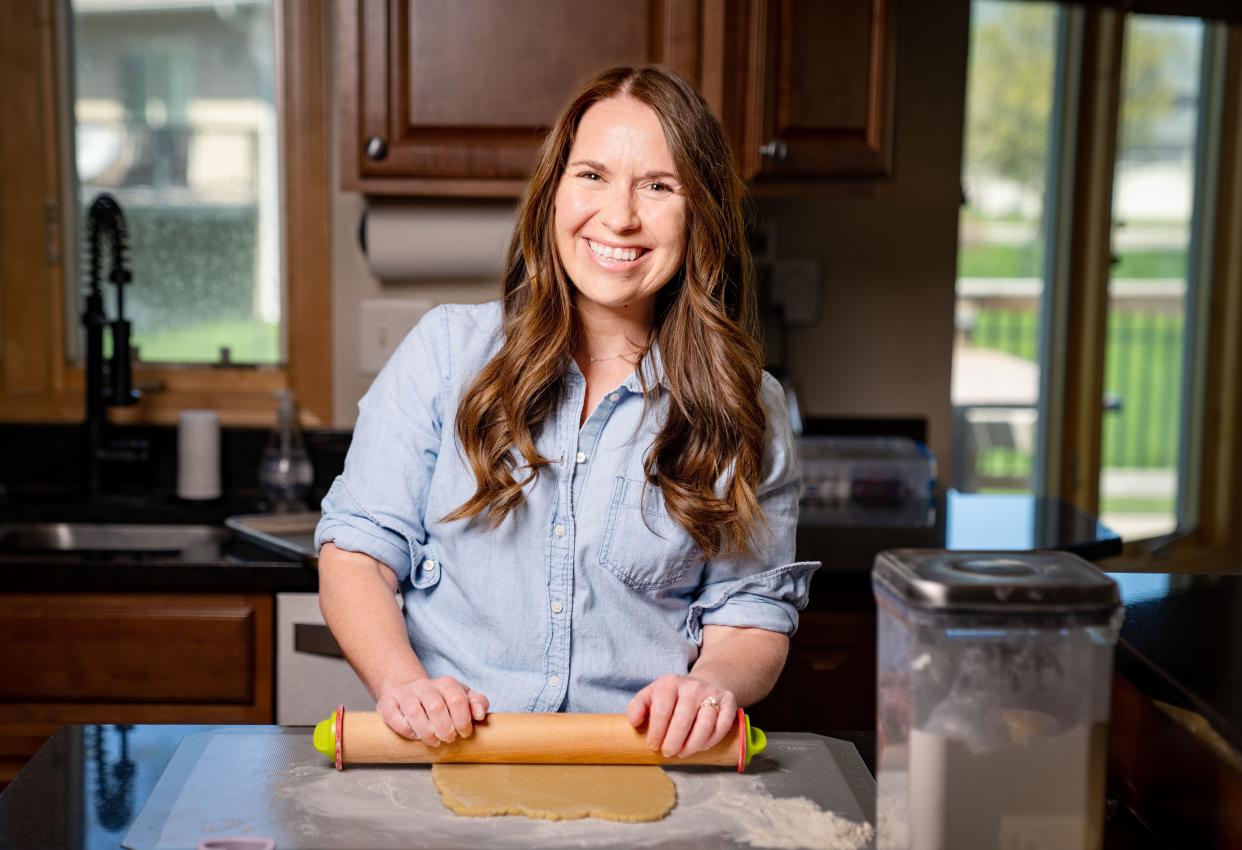 Jacqueline Brock makes Bitt of Sugar cookies at her West Des Moines home.