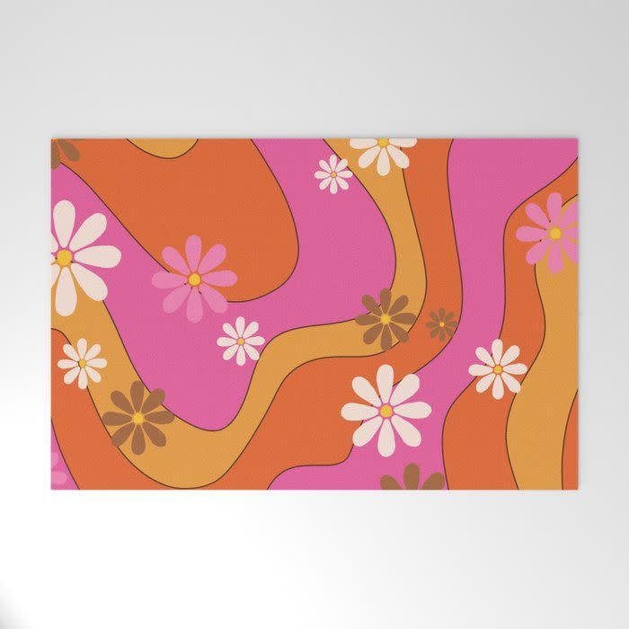 14) Groovy 60's and 70's Flower Power Pattern Welcome Mat