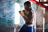 A boxer shadowboxes at Rafael Trejo boxing gym in Old Havana. The boxers train outside all year round.