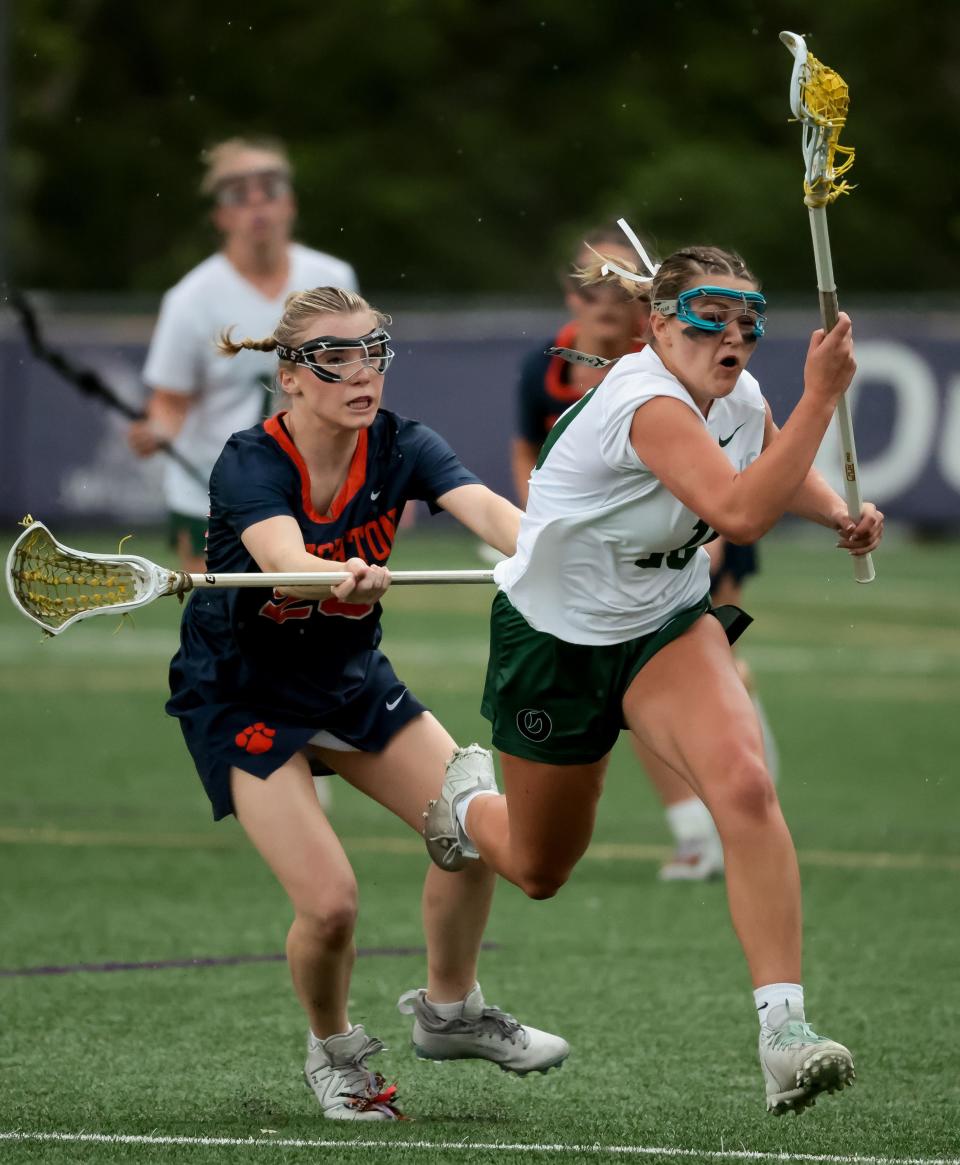 Brighton’s Alexandra Heugly pushes Olympus’s Eva Thorn as she drives up the field in a 5A girls lacrosse semifinal game at Westminster College in Salt Lake City on Tuesday, May 23, 2023. | Spenser Heaps, Deseret News