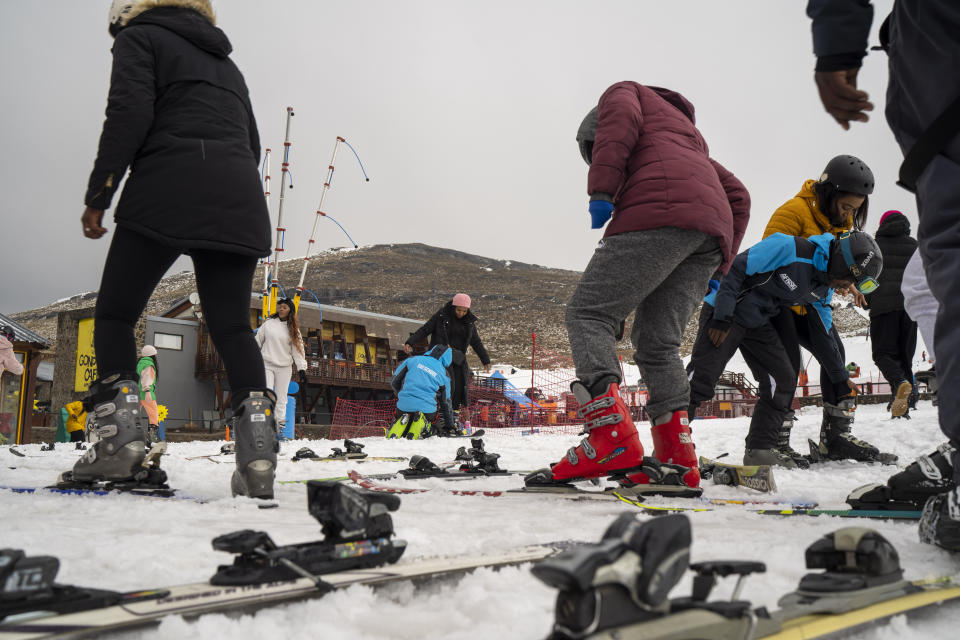 First time skiers get ready for their first lesson at the Afriski ski resort near Butha-Buthe, Lesotho, Saturday July 30, 2022. While millions across Europe sweat through a summer of record-breaking heat, Afriski in the Maluti Mountains is Africa's only operating ski resort south of the equator. It draws people from neighboring South Africa and further afield by offering a unique experience to go skiing in southern Africa. (AP Photo/Jerome Delay)