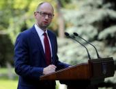 Ukrainian Prime Minister Arseny Yatseniuk delivers a speech in Kiev, August 8, 2014. REUTERS/Andrew Kravchenko/Pool