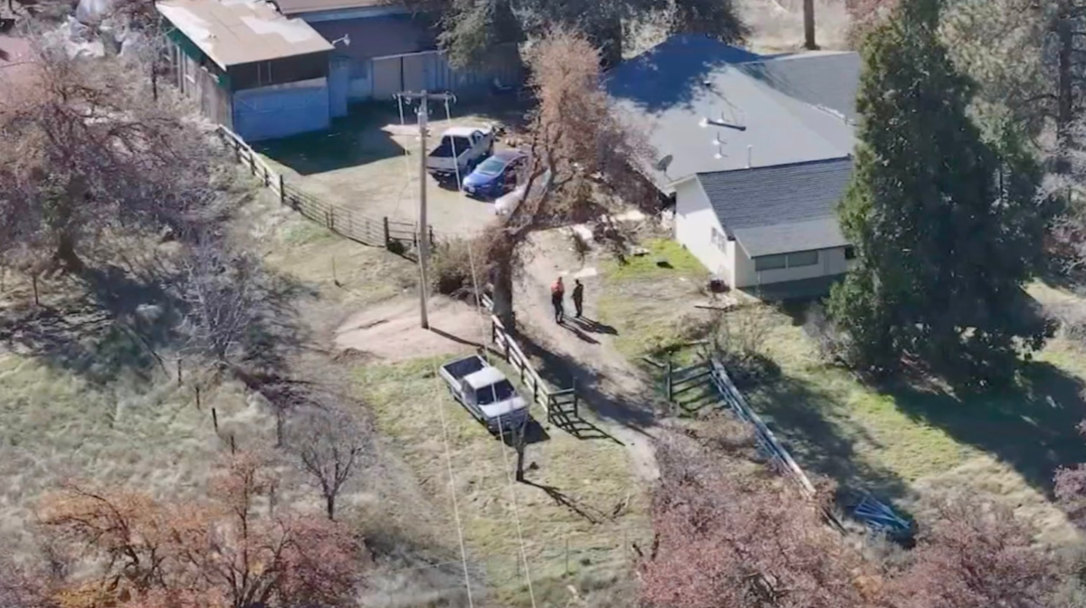 Law enforcement at the scene after a 14-year-old boy was arrested for allegedly murdering his parents and injuring his 11-year-old sister (KFSN)