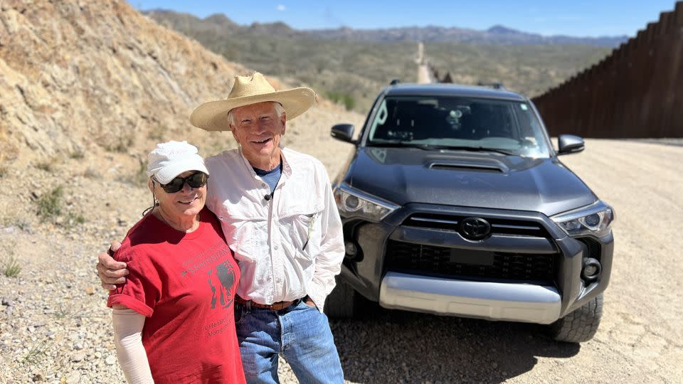 Paul Nixon and Laurel Grindy have been volunteering to help migrants in distress up and down these steep hills for about five years. - Rosa Flores/CNN