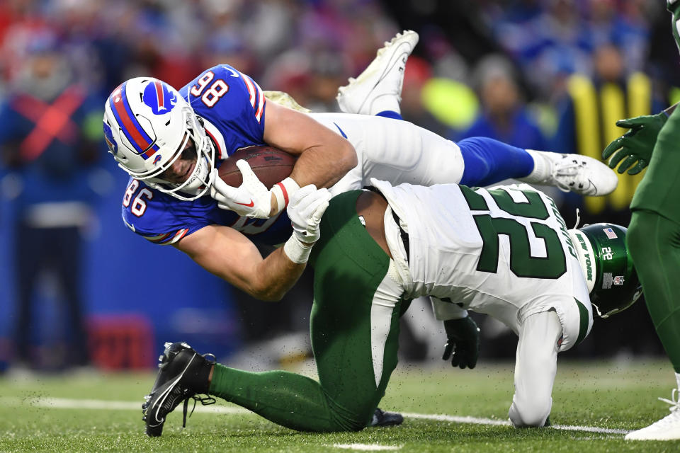 Buffalo Bills tight end Dalton Kincaid (86) is tackled by New York Jets safety Tony Adams (22) during the first half of an NFL football game in Orchard Park, N.Y., Sunday, Nov. 19, 2023. The Bills won 32-6. (AP Photo/Adrian Kraus)