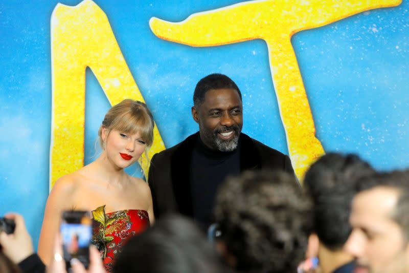 FILE PHOTO: Singer Taylor Swift and actor Idris Elba arrive for the world premiere of the movie "Cats" in Manhattan, New York
