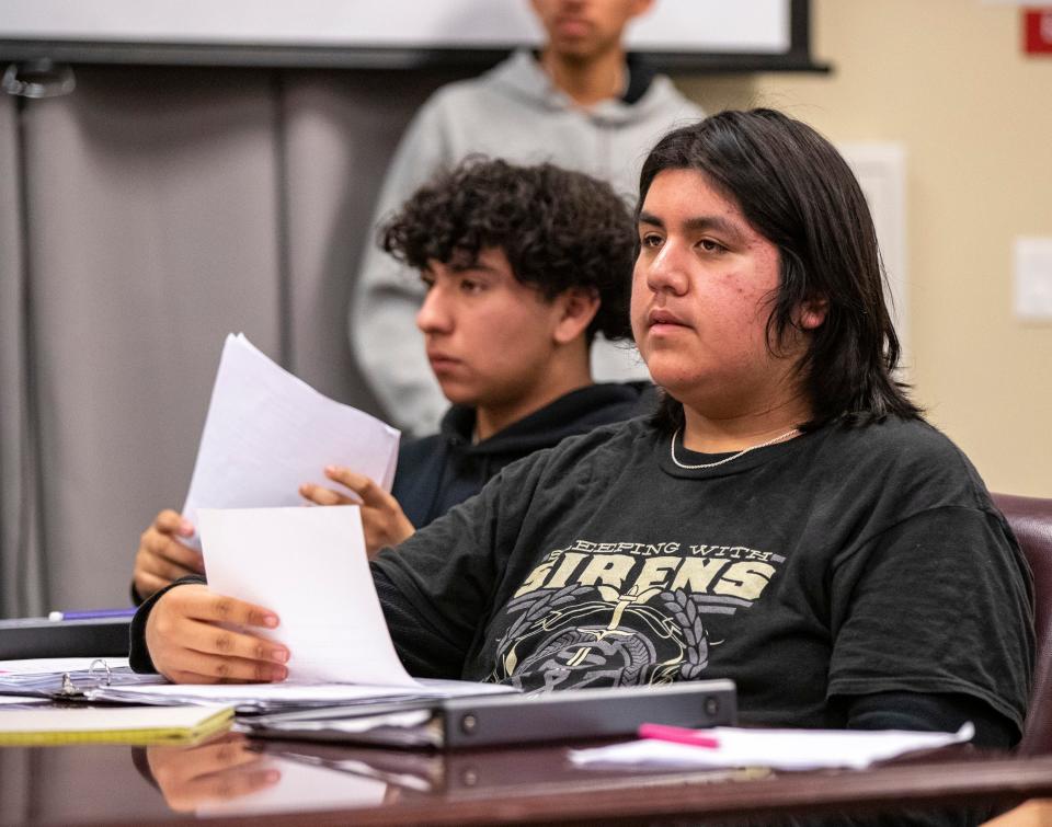 Defense Attorney Jared Arellano looks through notes while running through a case during a mock trial meeting at Indio High School in Indio, Calif., Wednesday, Feb. 7, 2024.