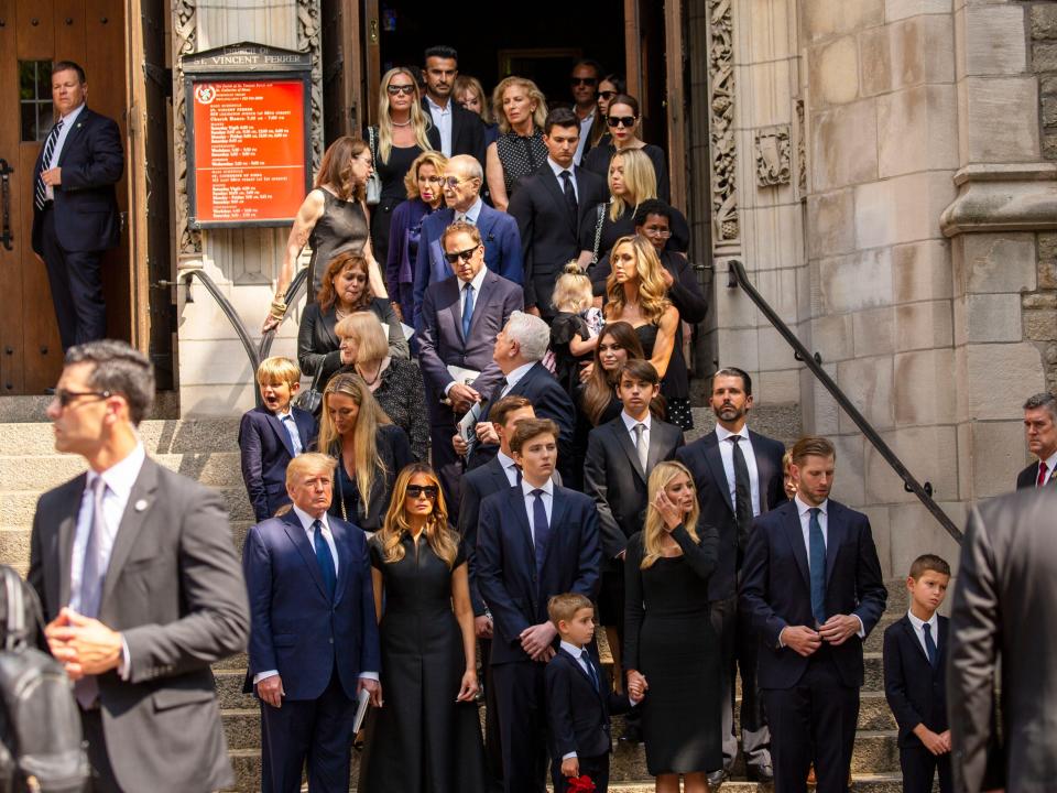 Donald Trump and family members gathered outside in front of a church.