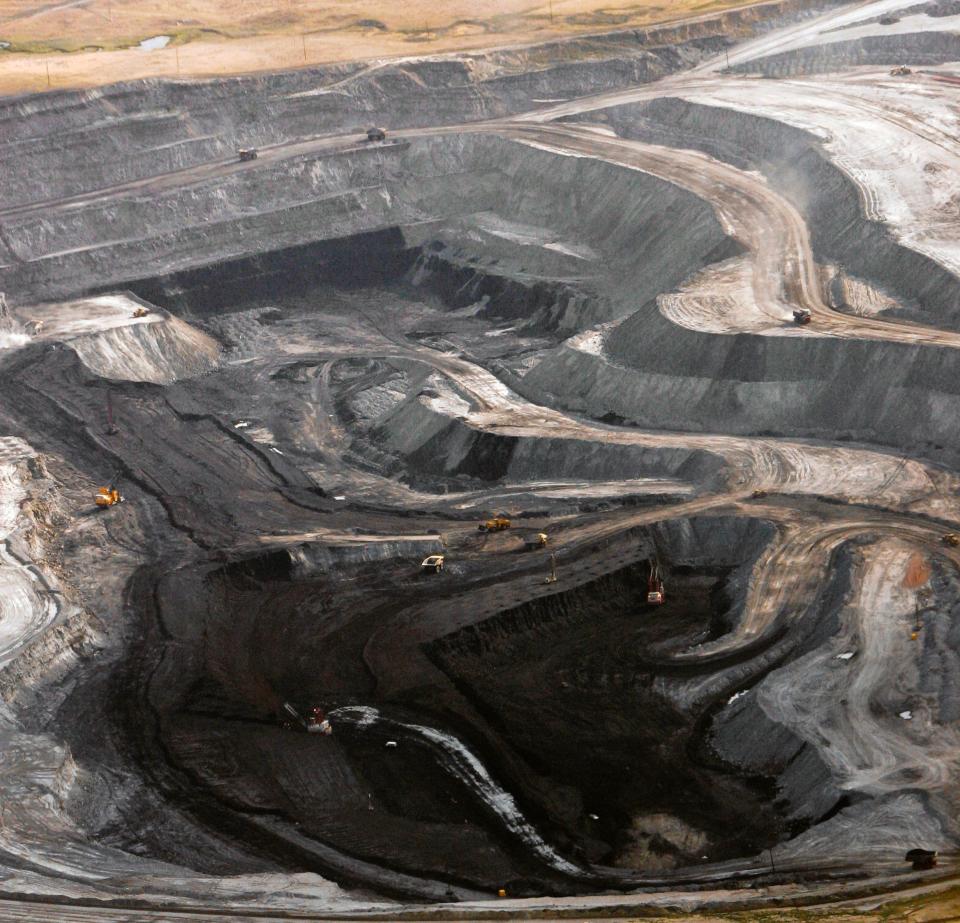 A coal mine is seen from the air near Gillette, Wyo., on Aug. 22, 2006. As one of the largest energy producers in the nation, Wyoming is no stranger to the debate over global warming. The state has tried to address climate change head-on without swerving from its energy-dependent economy.