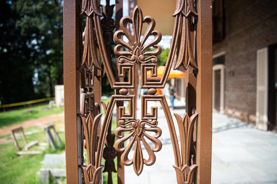 Crews stripped and repainted the intricate ironwork on site at the historic Eugenia Williams House on Lyons View Pike.