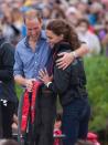 <p>The pair hugged it out after taking part in a dragon boat race at Dalvay-by-the-sea during the couple's North American Tour, July 2011.</p>