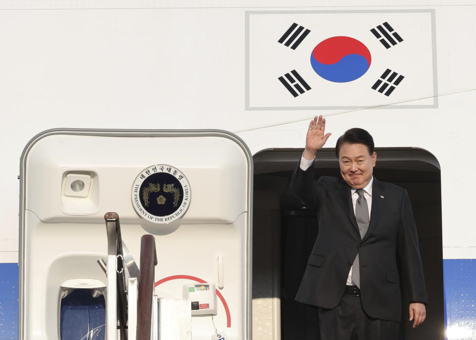 South Korean President Yoon Suk Yeol waves before departing for the United States at the Seoul military airport in Seongnam, South Korea, Thursday, Aug. 17, 2023. (Jin Sung-chul/Yonhap via AP)