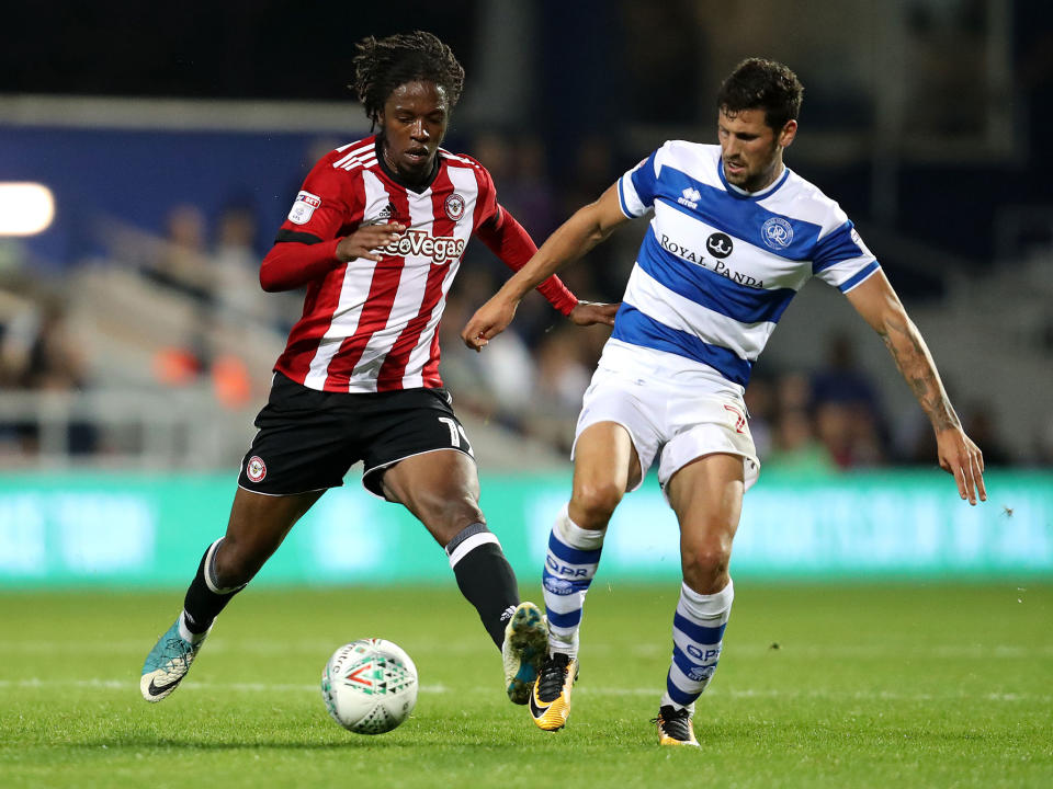 Romaine Sawyers and Paweł Wszołek tussle for possession: Getty