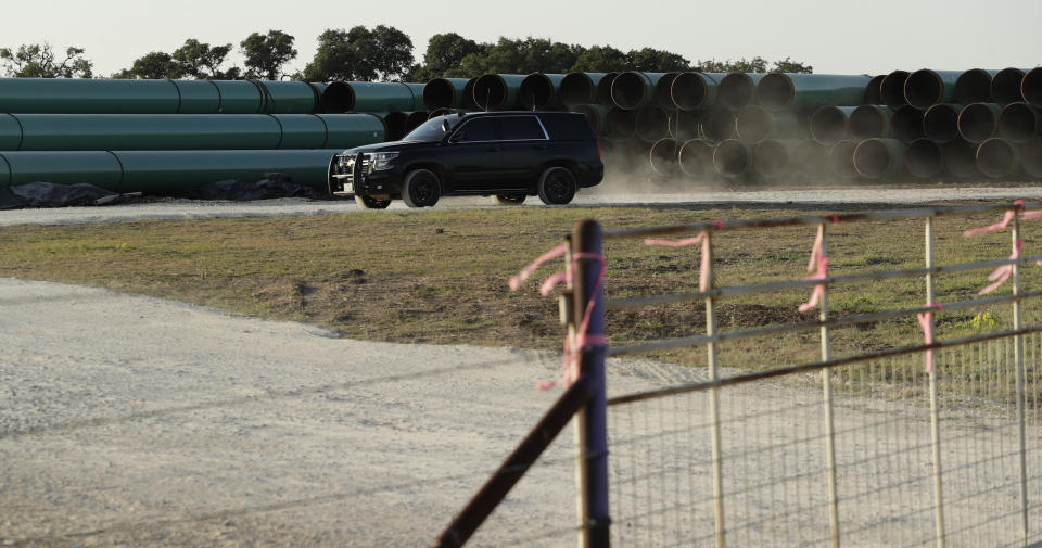 Pipes for a proposed new natural gas pipeline that would pass through the Texas Hill Country are staged near Blanco, Texas Friday, Aug. 2, 2019. A proposed pipeline is a 430-mile, $2 billion natural gas expressway that pipeline giant Kinder Morgan has mapped from the booming West Texas oil patch to Houston. (AP Photo/Eric Gay)