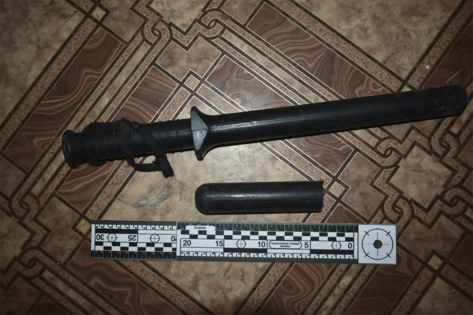 This photo provided by Ukrainian investigators in 2023 shows a baton found a building used by Russian forces in Izium, Ukraine. Civilians who had been detained by Russian soldiers described being tortured with instruments like this. (AP Photo)