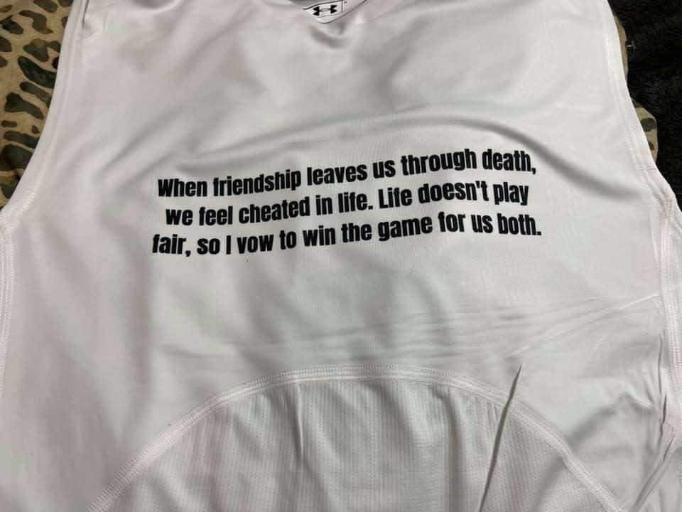 The message that Haiden Thompson wears on the back of his undershirt during athletic events.