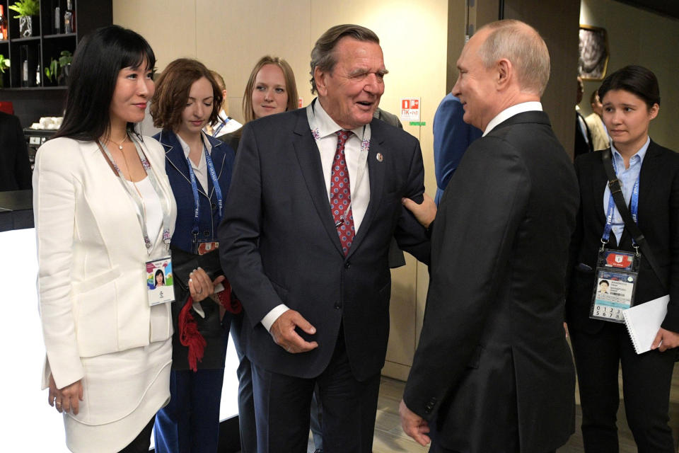 MOSCOW, RUSSIA - JUNE 14:  President Vladimir Putin, Gerhard Schroeder, Chairman of the Shareholders Committee with Nord Stream 2 AG and former German chancellor, and his wife Kim So-yeon (R-L) attend the President's Lounge during during the opening ceremony prior to the 2018 FIFA World Cup Russia Group A match between Russia and Saudi Arabia at Luzhniki Stadium on June 14, 2018 in Moscow, Russia.  (Photo by Pool/Getty Images)