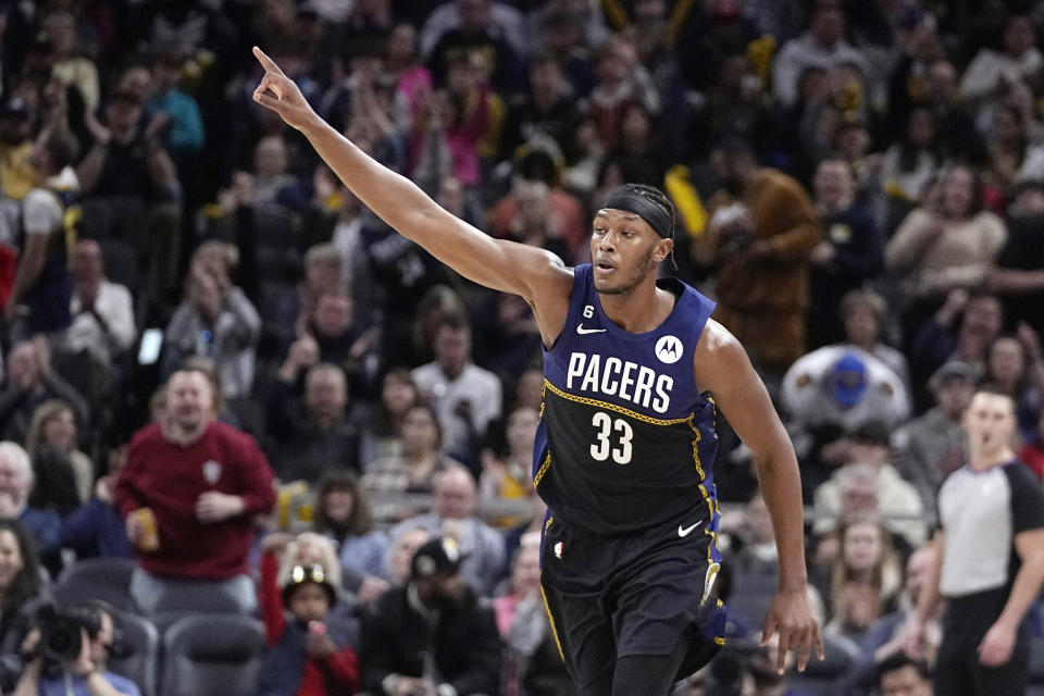 Indiana Pacers' Myles Turner reacts after making a shot during the second half of an NBA basketball game against the LA Clippers, Saturday, Dec. 31, 2022, in Indianapolis. (AP Photo/Darron Cummings)