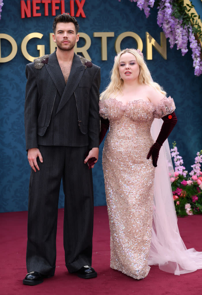 Luke Newton and Nicola Coughlan attend the "Bridgerton" season three part two premiere on June 12 in London, Rodarte dress, red carpet, sequins, veil, Emporio Armani suit