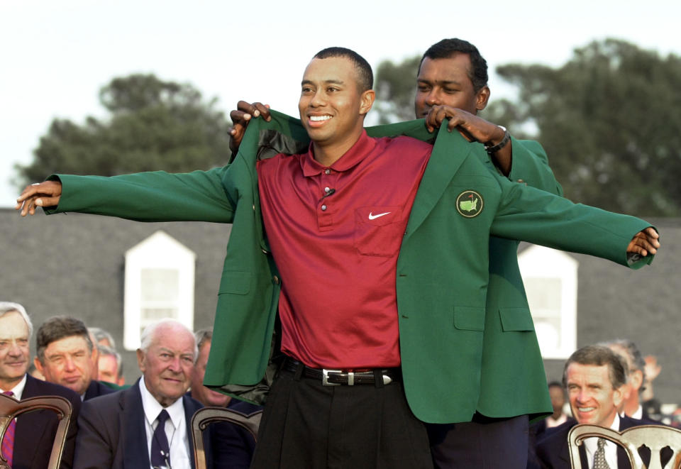 <p>Tiger Woods, left, receives his Masters green jacket from last year’s champion Vijay Singh, of Fiji, at a ceremony after winning the 2001 Masters at the Augusta National Golf Club in Augusta, Ga., Sunday, April 8, 2001. Woods captured this second Masters title, defeating David Duval by two strokes. (AP Photo/Amy Sancetta) </p>