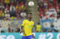 Brazil's Vinicius Junior eyes the ball during the World Cup round of 16 soccer match between Brazil and South Korea, at the Stadium 974 Stadium in Doha, Qatar, Monday, Dec. 5, 2022. (AP Photo/Andre Penner)