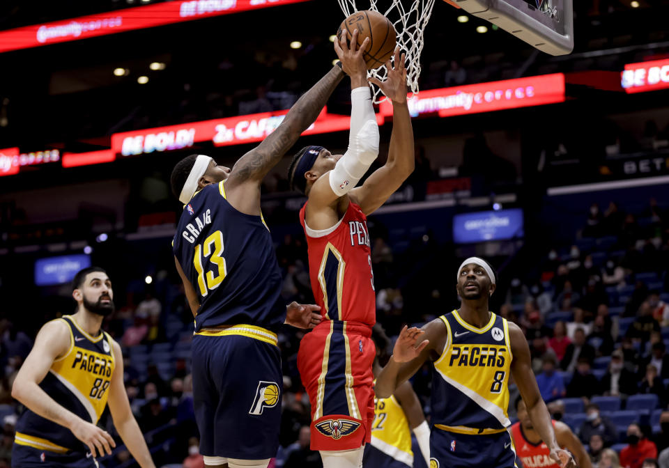 New Orleans Pelicans guard Josh Hart (3) shoots over Indiana Pacers forward Torrey Craig (13) in the fourth quarter of an NBA basketball game in New Orleans, Monday, Jan. 24, 2022. (AP Photo/Derick Hingle)