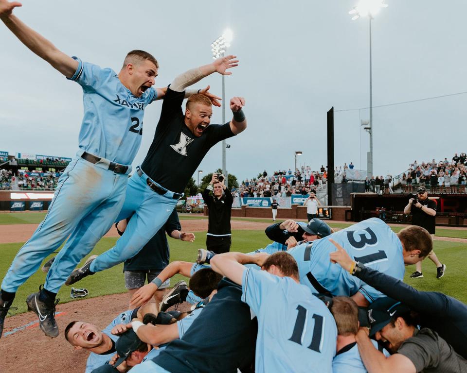 The Xavier Musketeers celebrate winning the Big East baseball title over the Connecticut Huskies.