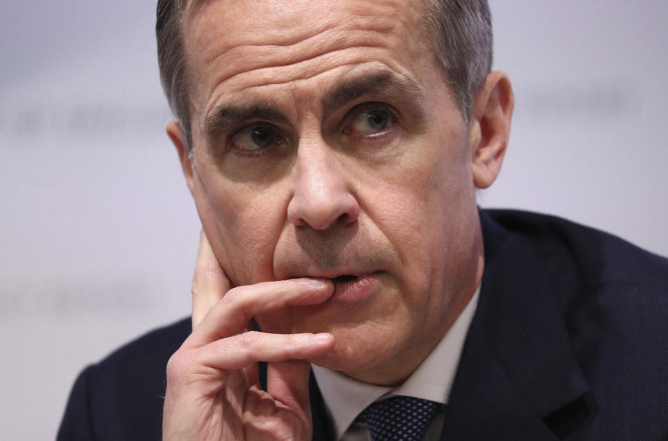 Mark Carney, Governor of the Bank of England attends the Bank of England's Monetary Policy Report news conference in the City of London, Thursday Jan. 30, 2020. The Bank of England on Thursday opted against cutting interest rates after a run of fairly firm economic data in the past week eased fears about a dramatic slowdown in the British economy. (Jonathan Brady/Pool via AP)