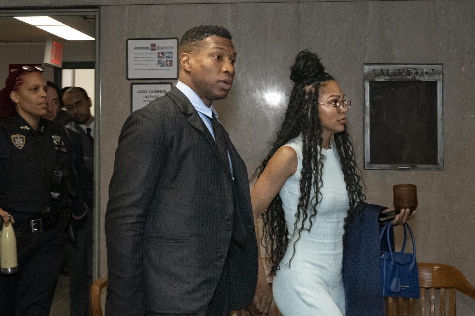 Jonathan Majors, left, accompanied by girlfriend Meagan Good, enters a courtroom at the Manhattan Criminal Courthouse in New York, Thursday, Dec. 14, 2023. (AP Photo/Peter K. Afriyie)