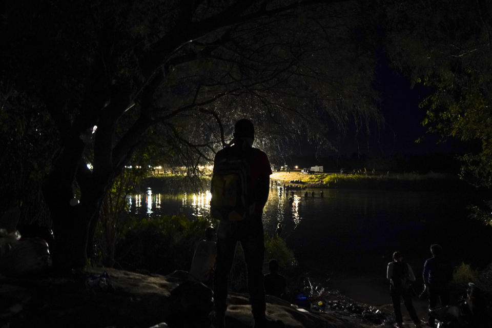 A Haitian migrant stands on the Mexican side of the border before crossing the Rio Grande to Del Rio, Texas, from Ciudad Acuna, Thursday, Sept. 23, 2021. Some of the thousands of Haitian migrants who briefly formed a camp in the Texas border town have found a helping hand in Acuna. (AP Photo/Fernando Llano)