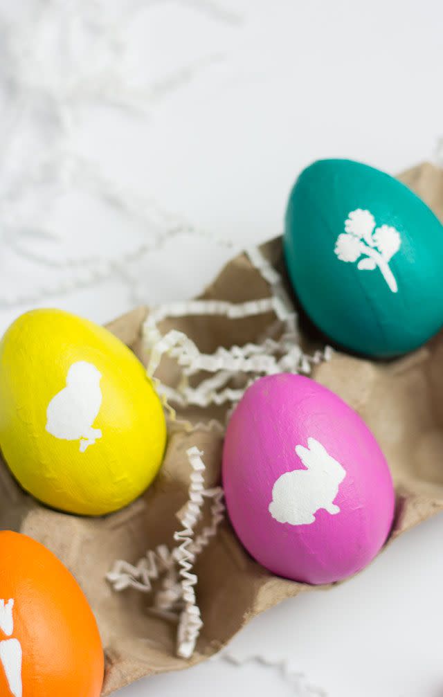 <p>First, paint your whole egg with a coat of craft paint in any color you like. Then, use stencils to add contrasting details that are perfectly on theme for the holiday — like bunnies, carrots, flowers, or baby chicks.</p><p><a href="https://designimprovised.com/2015/03/easter-egg-ideas10.html" rel="nofollow noopener" target="_blank" data-ylk="slk:Get the tutorial at Design Improvised;elm:context_link;itc:0;sec:content-canvas" class="link "><em>Get the tutorial at Design Improvised </em></a></p>