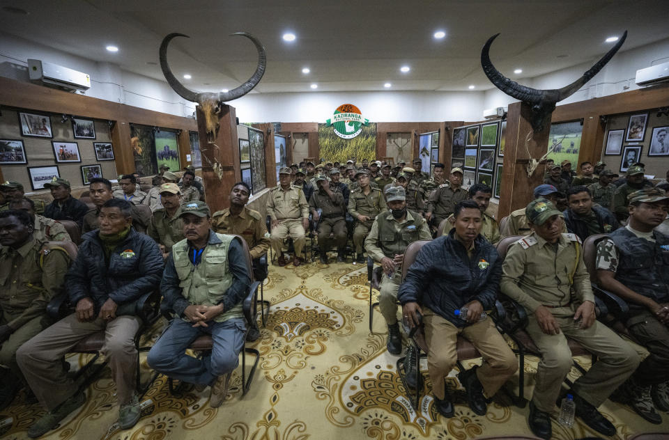 Forest officers attend a briefing session on counting rhinos for a census drive in Kaziranga national park, in the northeastern state of Assam, India, Friday, March 25, 2022. Nearly 400 men using 50 domesticated elephants and drones scanned the park’s 500 square kilometers (190 square miles) territory in March and found the rhinos' numbers increased more than 12%, neutralizing a severe threat to the animals from poaching gangs and monsoon flooding. (AP Photo/Anupam Nath)