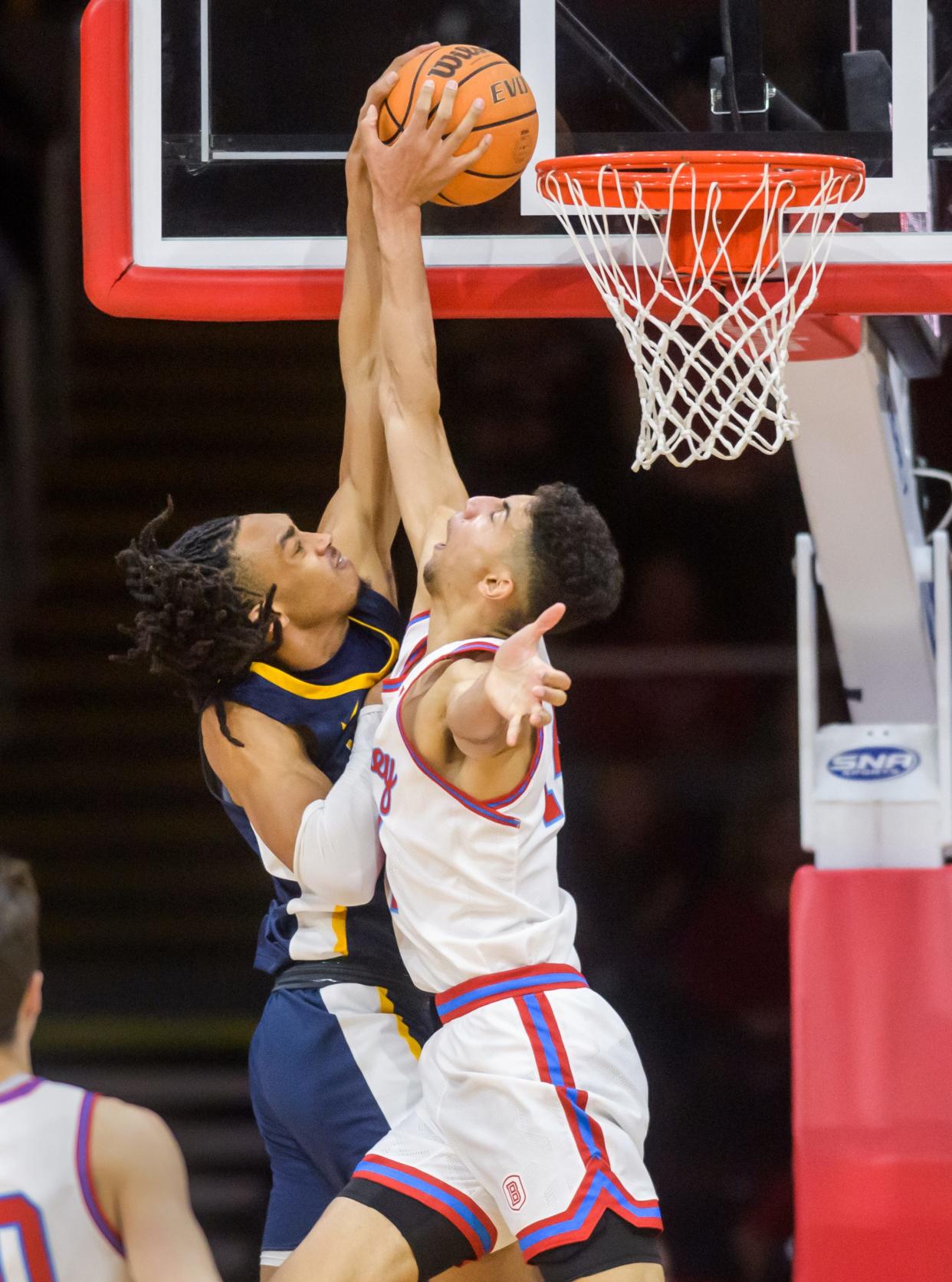 Bradley's Malevy Leons, right, blocks a shot at the rim from Murray State's Kenny White Jr. in the first half Saturday, Feb. 11, 2023 at Carver Arena. The Braves rolled over the Racers 83-48.