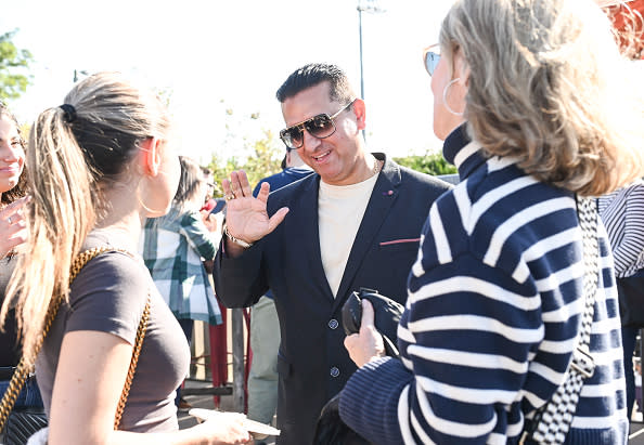 NEW YORK, NEW YORK – OCTOBER 15: Buddy Valastro poses with guests at the Ultimate Pizza Party hosted by Buddy Valastro during the Food Network New York City Wine & Food Festival presented by Capital One on October 15, 2022 in New York City. (Photo by Daniel Zuchnik/Getty Images for NYCWFF)