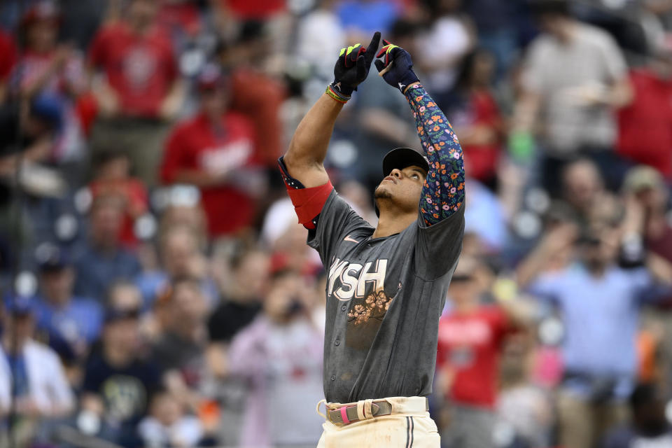 Washington Nationals' Juan Soto celebrates his two-run home run during the fifth inning of a baseball game against the Milwaukee Brewers, Saturday, June 11, 2022, in Washington. (AP Photo/Nick Wass)